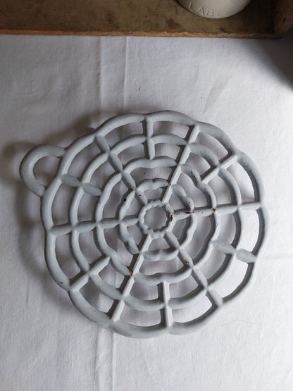 Dessous de plat en fonte